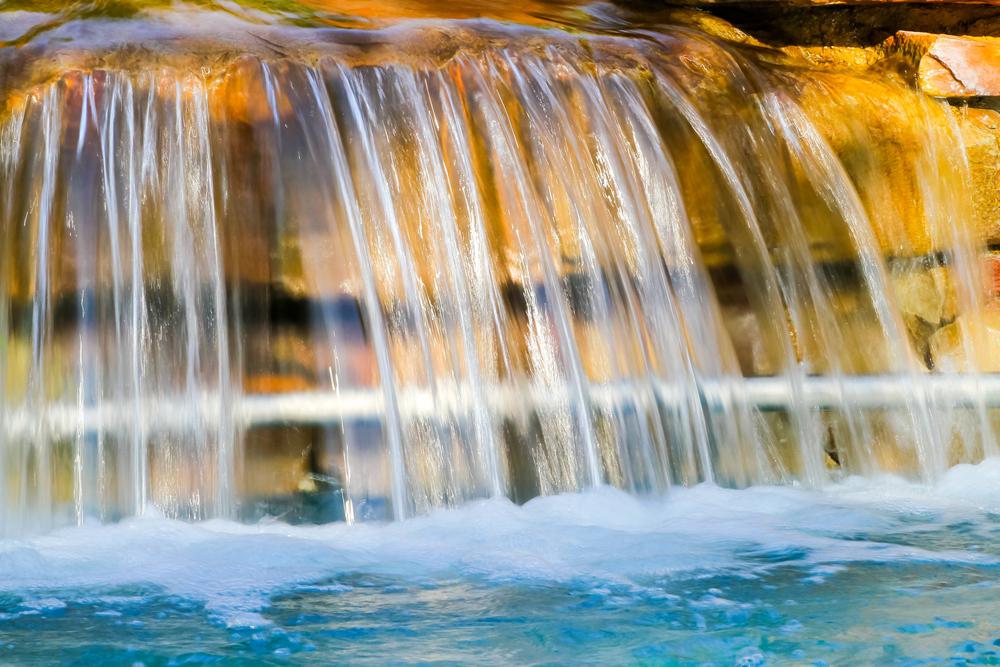Small,Waterfall,Beside,The,Pool.